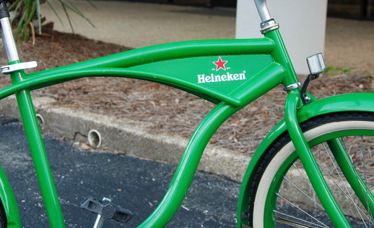 Green bicycle with Heineken logo on a blurred background